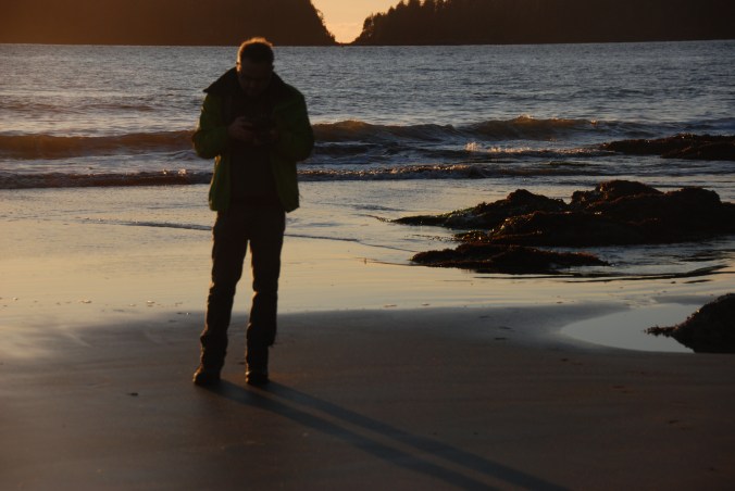 photo of photograher poring over camera